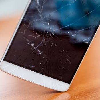 Broken screen glass of a smartphone after falling on the ground